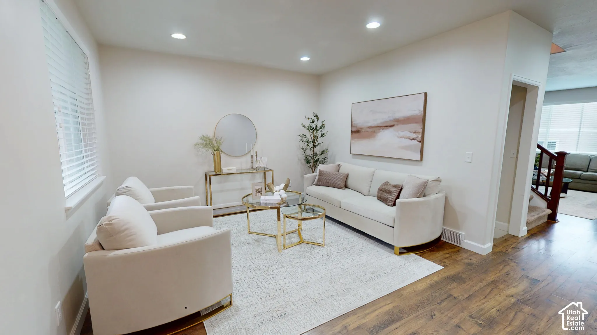 Sitting room featuring wood-finish flooring, recessed lighting, and horizontal window blinds