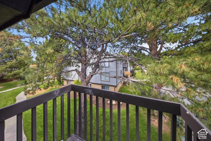 Private balcony with dark wood railing