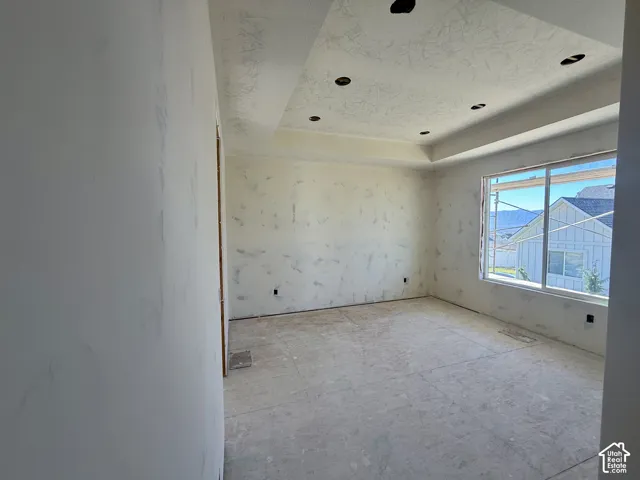 Primary Bedroom with a tray ceiling