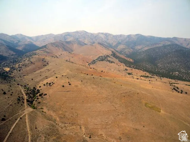 View of mountain backdrop with rural landscape