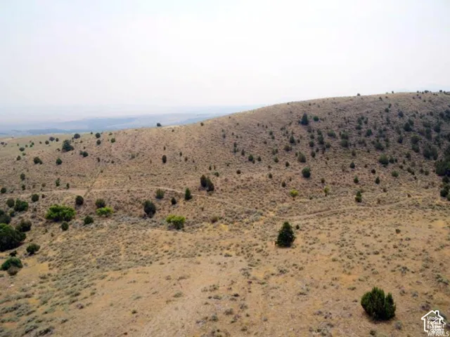 View of mountain backdrop featuring rural landscape and a desert landscape