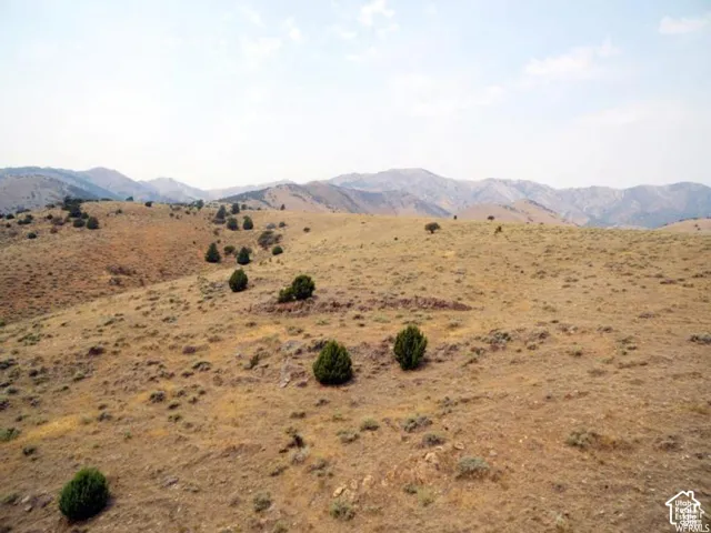 View of mountain background featuring rural landscape