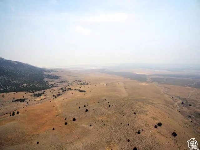 Aerial overview of property's location featuring rural landscape and a mountain backdrop