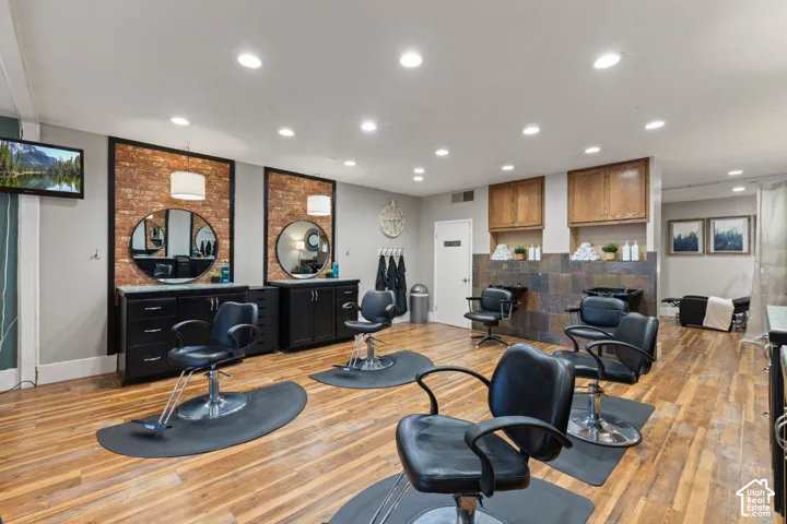 Fully equipped styling stations - Moden salon chairs, elegant mirrors, custom cabinetry and warm inviting finishes create a professional, welcoming atmosphere in this turnkey salon space.