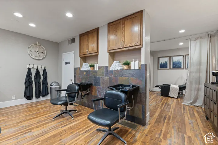 Two Professional Shampoo & Wash Stations with Built-In Cabinetry and Tile Surround