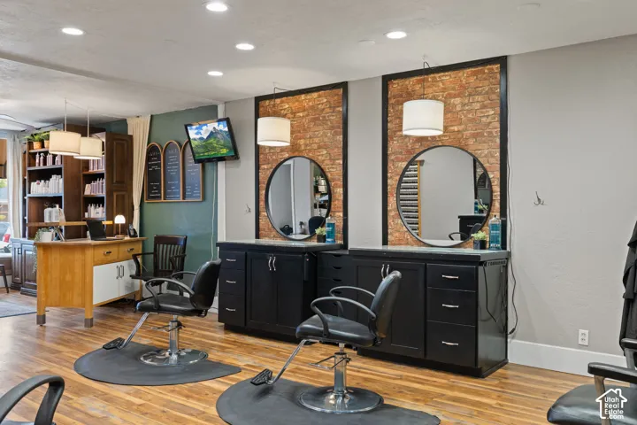 Fully equipped styling stations - Moden salon chairs, elegant mirrors, custom cabinetry and warm inviting finishes create a professional, welcoming atmosphere in this turnkey salon space.