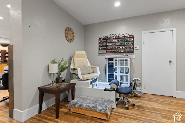 Fully equipped pedicure station with comfortable seating, foot spa and organized polish display.