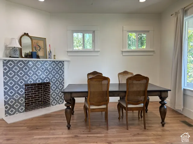 Wood-finish flooring, white walls, and recessed lighting