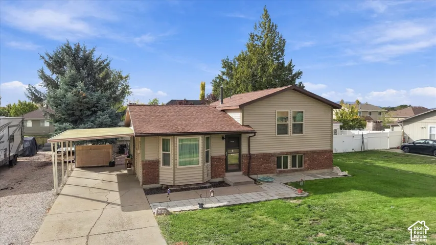 Exterior featuring a beige vinyl-sided fa