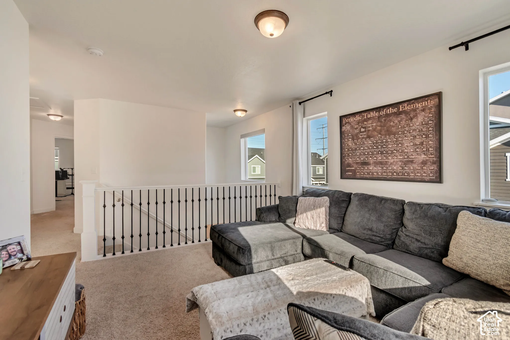 Carpeted flooring, white walls, and white ceilings create a neutral palette