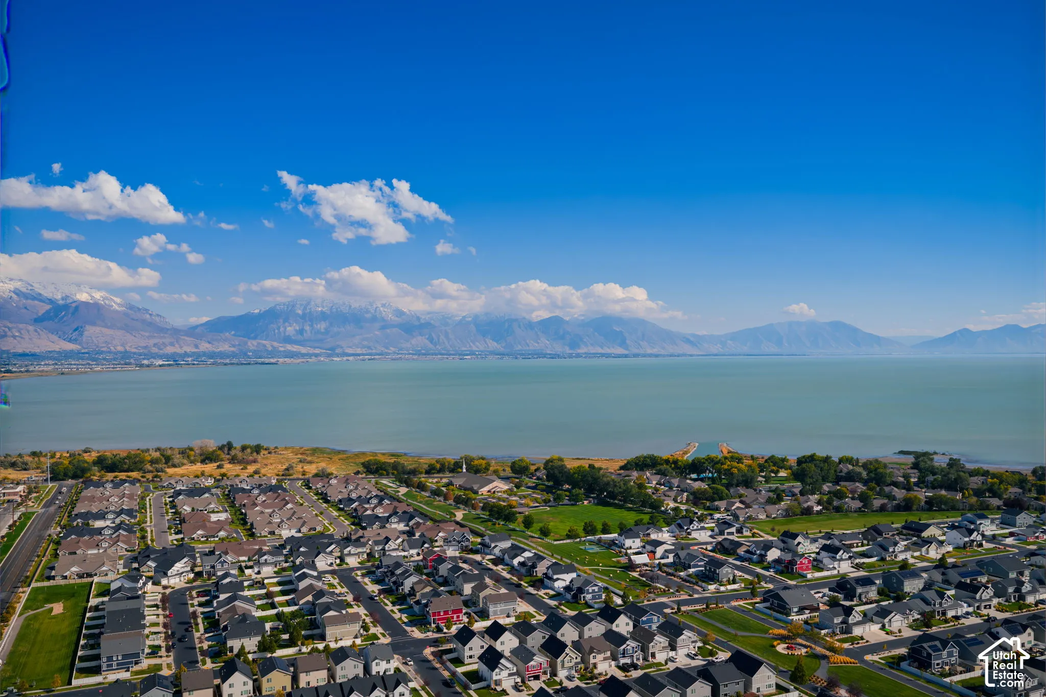 Aerial perspective featuring extensive lakefront proximity and expansive mountain range scenery