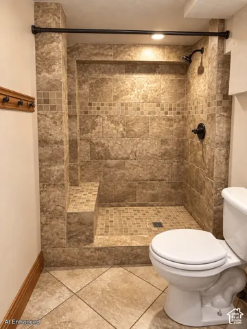 Walk-in shower featuring floor-to-ceiling stone-finish tile, built-in bench seating, decorative mosaic tile accents, and oil-rubbed bronze fixtures