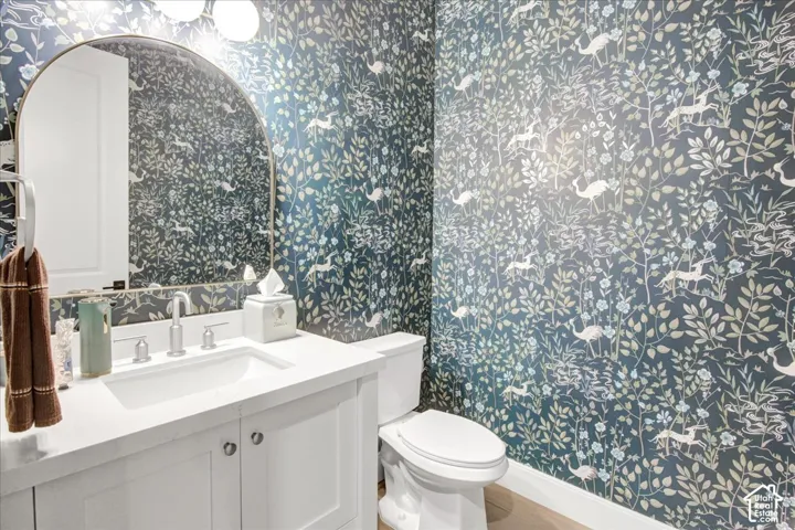 Vanity with an integrated rectangular sink, polished chrome faucet, and quartz countertop