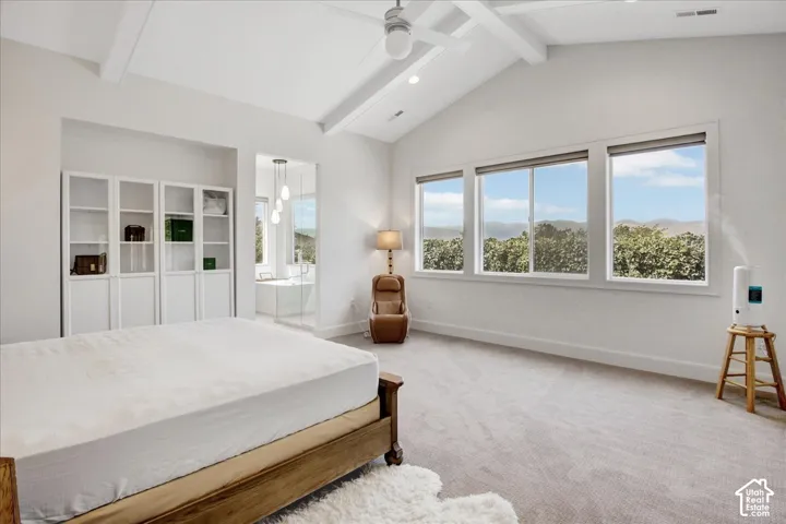 Vaulted ceiling with exposed beams, recessed lighting, and a ceiling fan