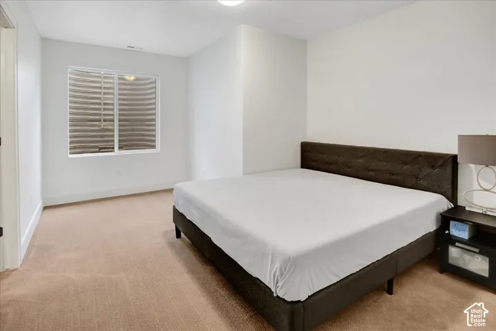 Wall-to-wall carpeting and white walls