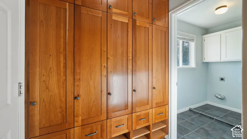 Great cherry hardwood storage off of the kitchen