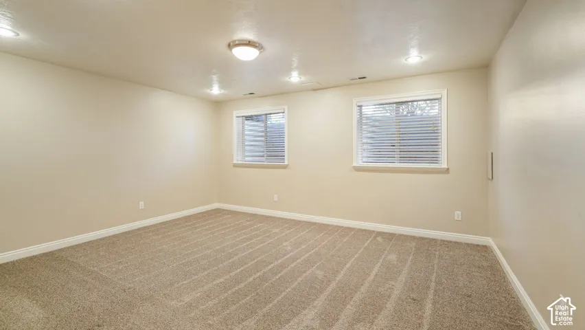 Basement bedroom with carpet