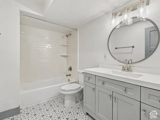 Bathroom featuring a vanity with light