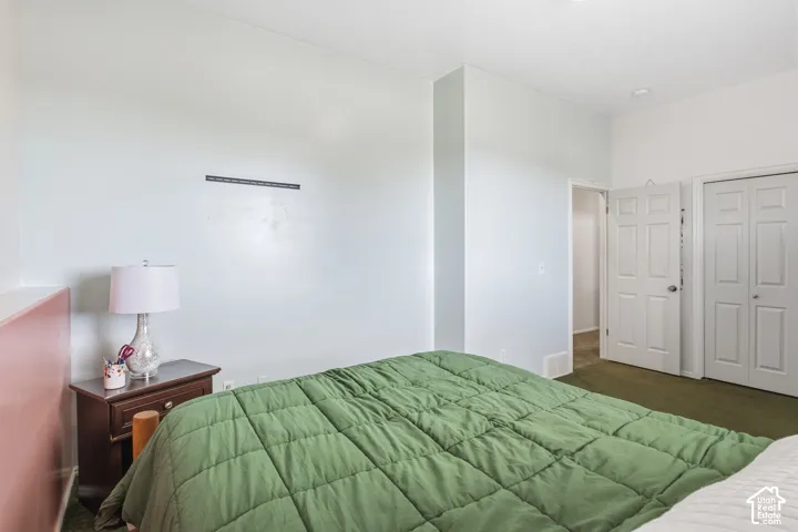 Room featuring a double-panel interior door, bi-fold closet doors, and neutral wall color