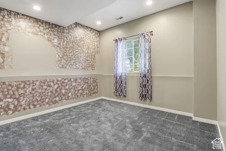 Room featuring recessed lighting, gray carpeting, and chair rail molding