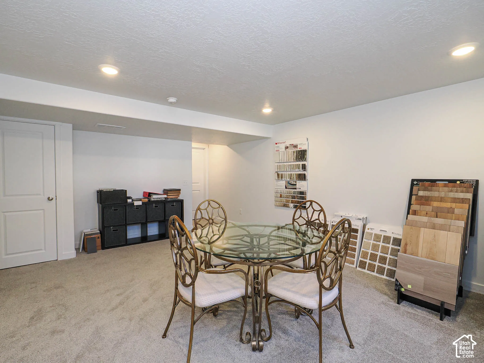 Neutral wall-to-wall carpeting, recessed ceiling lighting, and solid-core interior doors