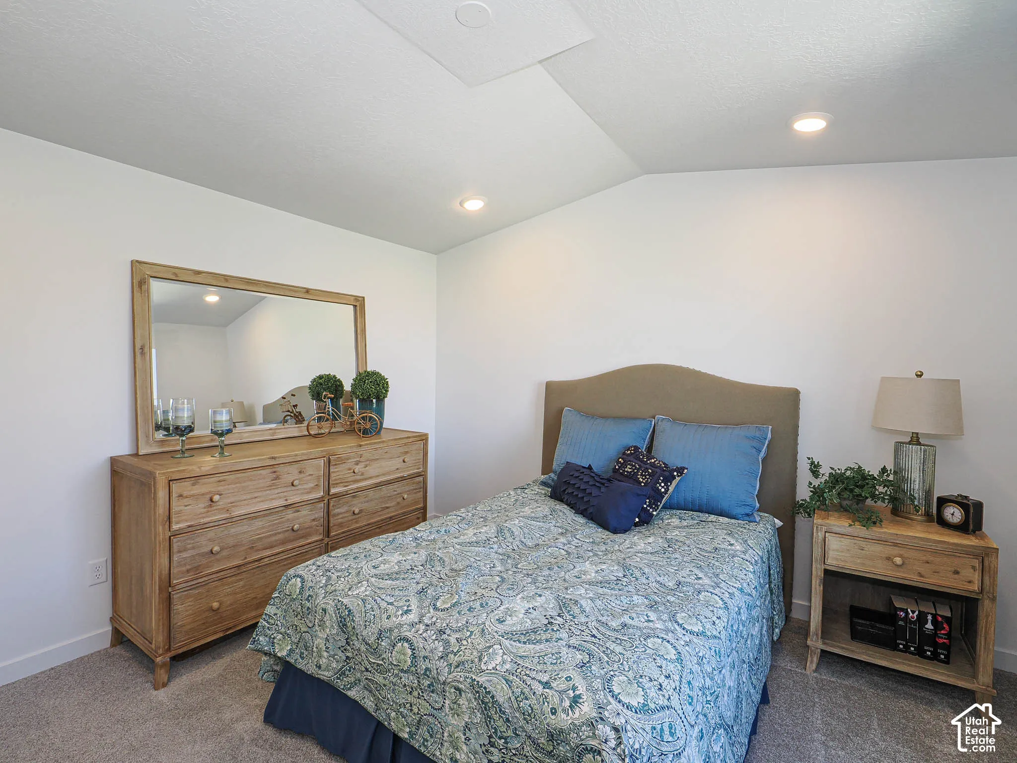 Vaulted ceiling featuring recessed lighting and neutral wall-to-wall carpeting