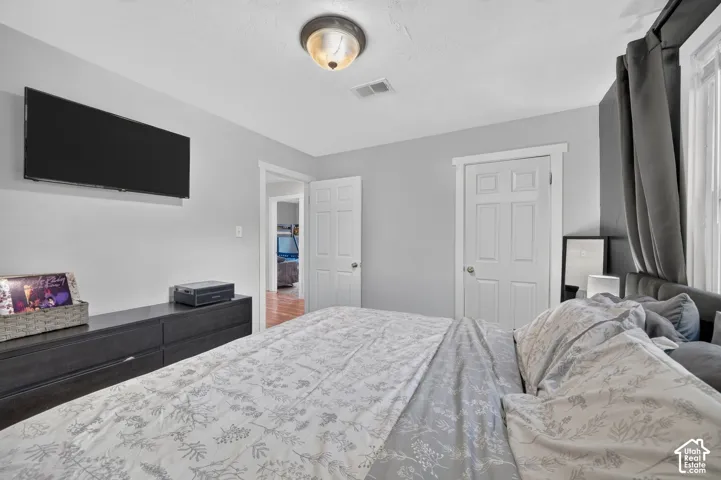Another view of the primary, looking back toward the door. The hall and the bunk bedroom are visible beyond it.