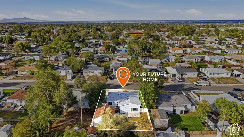 The lot is outlined here: 0.15 acres in Kearns with the house, fenced backyard and detached garage. Shopping, everyday essentials and commuter routes are close by in the heart of the Salt Lake Valley.