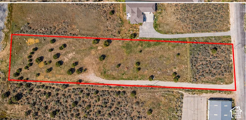 RV and Vehicles are no longer on the property so they were removed with AI just to show the raw land .