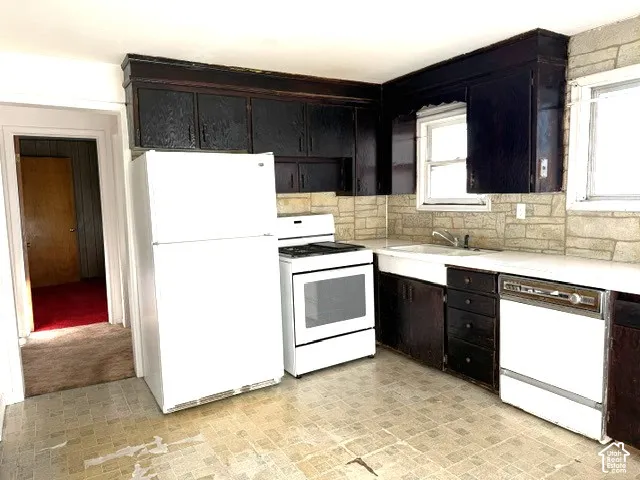Kitchen featuring dark-finished cabinetry