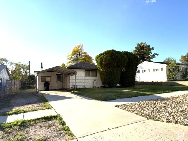 Single-story exterior with a covered carport