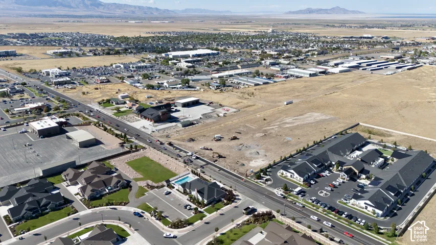 Aerial perspective of a developed residential area with multiple structures and a road network