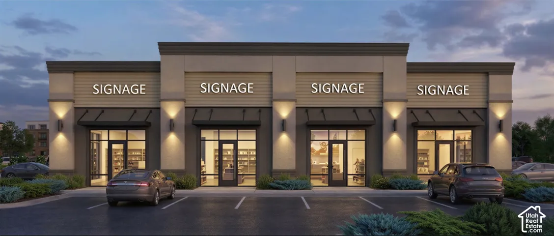 Commercial exterior featuring a multi-unit facade with glass storefronts, dedicated signage areas, metal awnings, and an asphalt parking lot