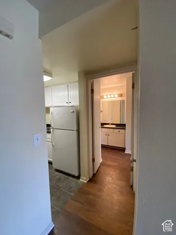 Kitchen featuring white cabinetry and tile flooring