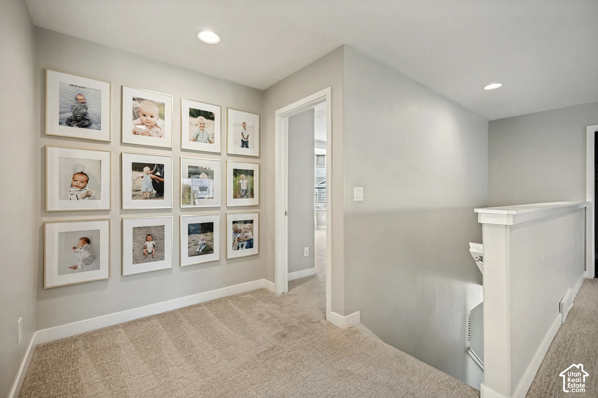 Neutral wall palette, neutral-toned wall-to-wall carpeting, and recessed ceiling lighting