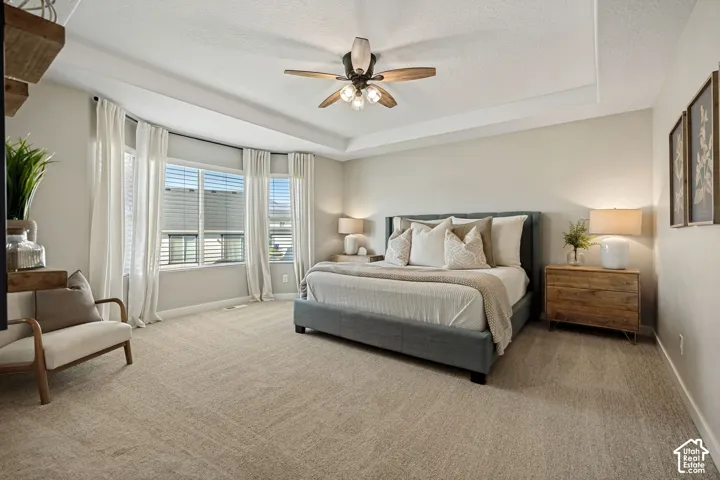 Tray ceiling, bay window, and integrated multi-blade ceiling fan with light fixture