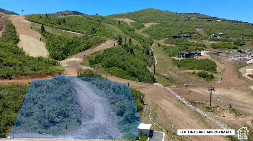 Sloped residential lot featuring mountainous topography and direct access to ski resort terrain