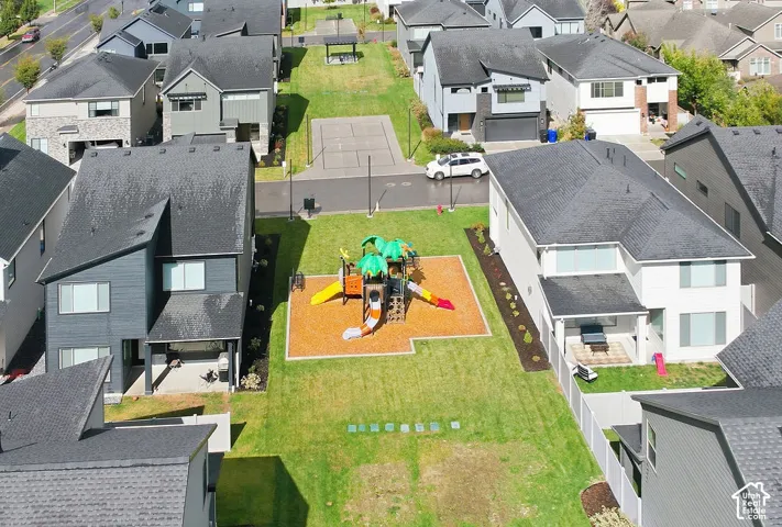 Common area featuring a recreational playground, multi-purpose sport court, and open green space