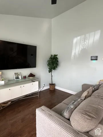 Wood-finish flooring, high ceilings, and an integrated wall-mounted smart home control panel