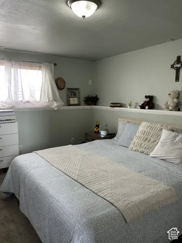 Room featuring a built-in display ledge and a flush-mount ceiling light fixture