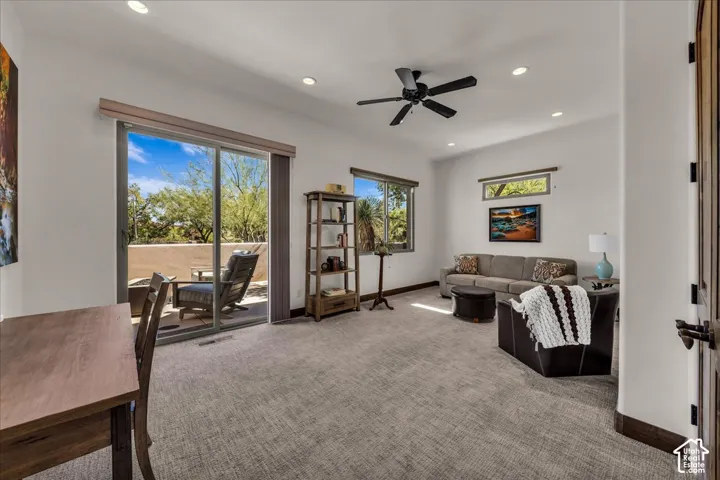 Spacious room with recessed lighting, ceiling fan, and carpeted flooring