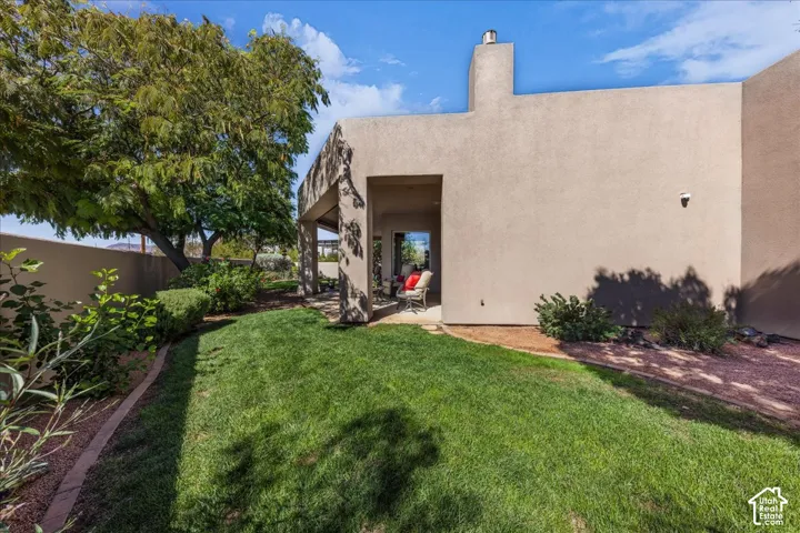 Expansive lawn area with mature trees and perimeter landscaping