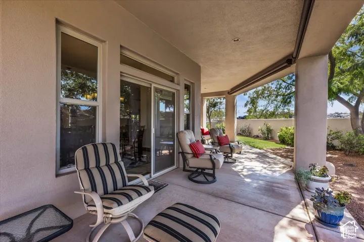 Covered patio with concrete flooring, recessed lighting, and direct access to a landscaped yard