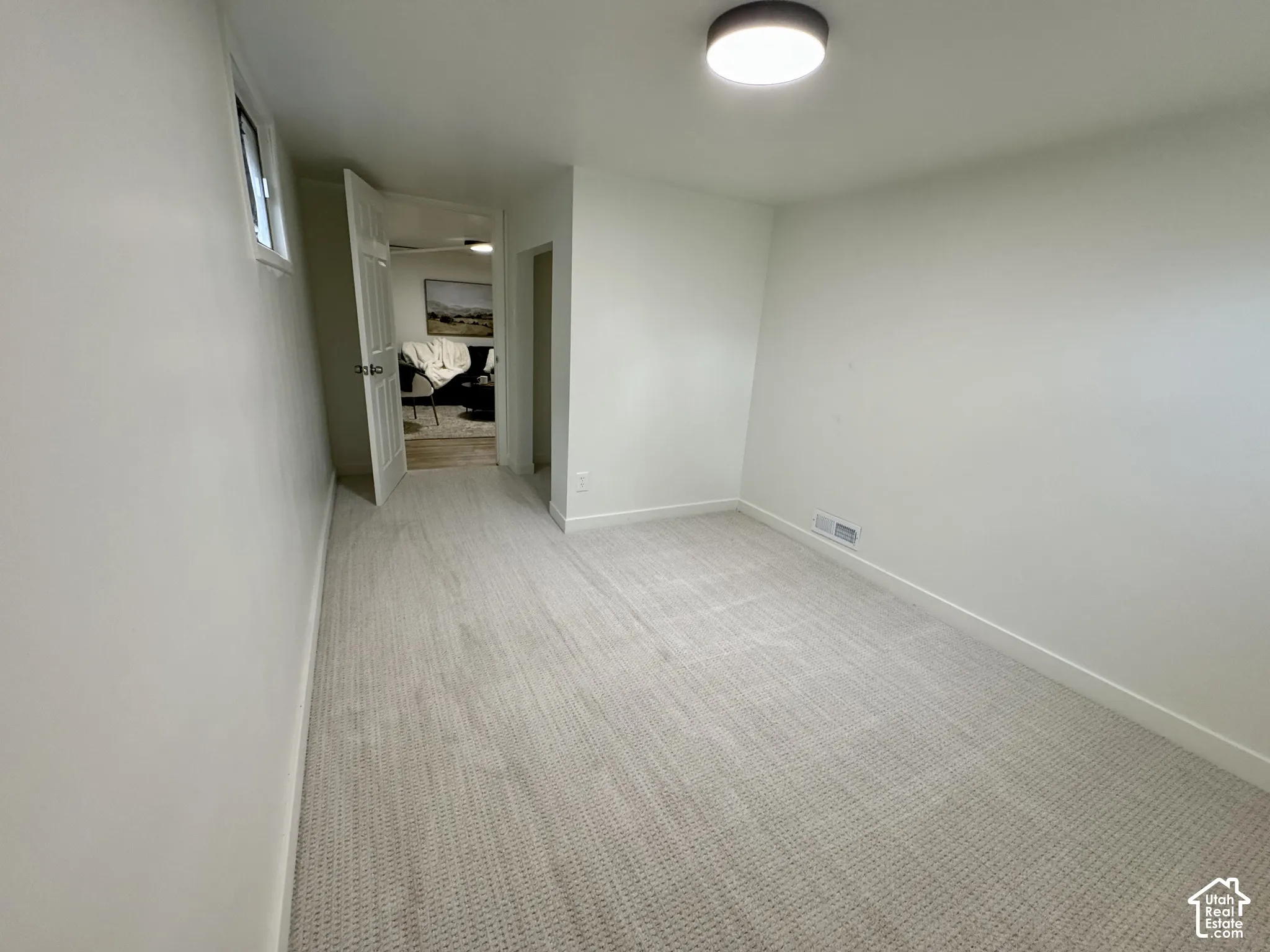 Basement level bedroom 2 with new fresh carpet.