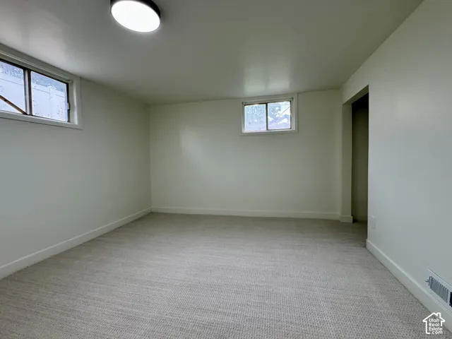 Basement level bedroom 1 with new fresh carpet.