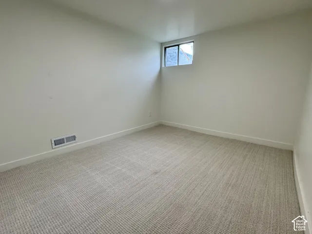 Basement level bedroom 2 with new fresh carpet.