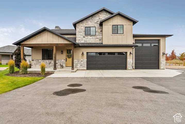 Modern exterior with stone accents and board-and-batten siding