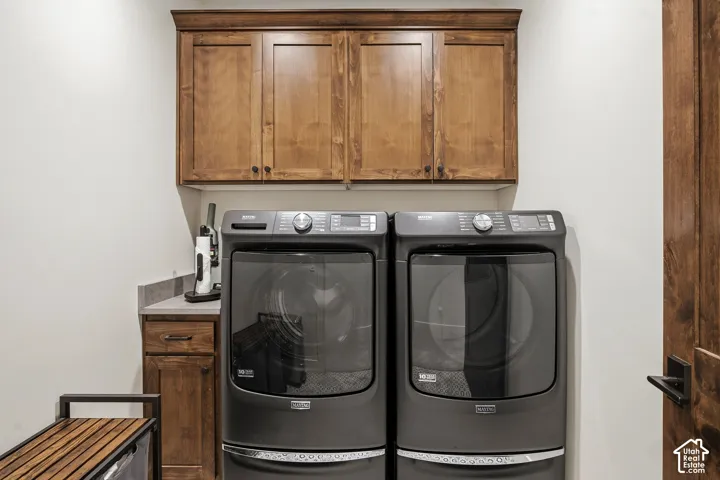 Built-in cabinetry with wood-finish doors, durable countertop, and wood-finish door