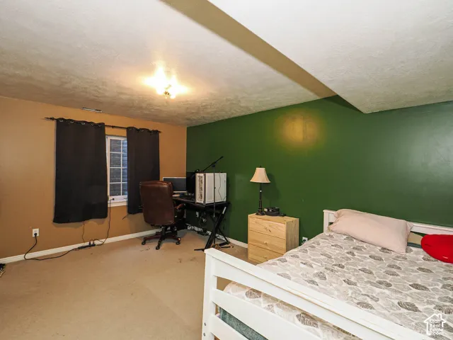 Interior space featuring wall-to-wall carpeting, a multi-pane window, and a recessed ceiling light