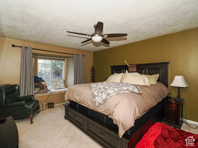 Bay window with an integrated bench seat and a ceiling-mounted light fixture with a fan